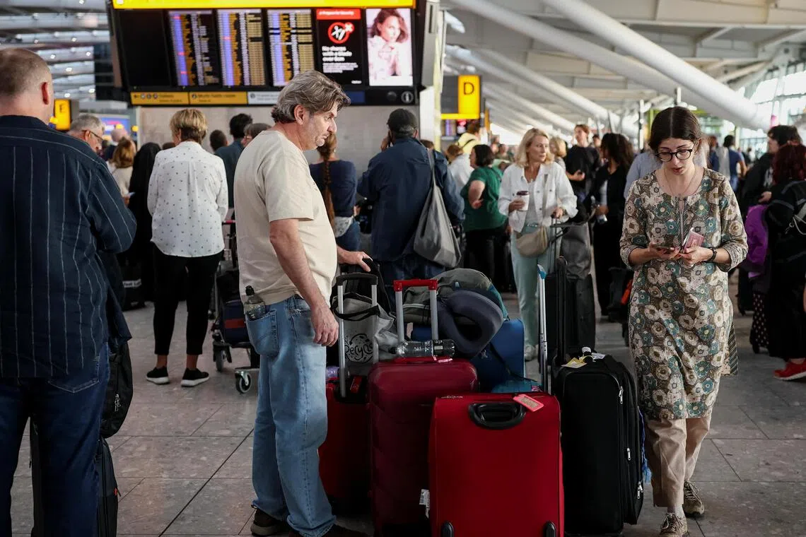 Stranded passengers at Heathrow Airport’s Terminal 5 in London, Britain, on Sept 8, after a technical issue disrupted hundreds of flights at key airports around the country.