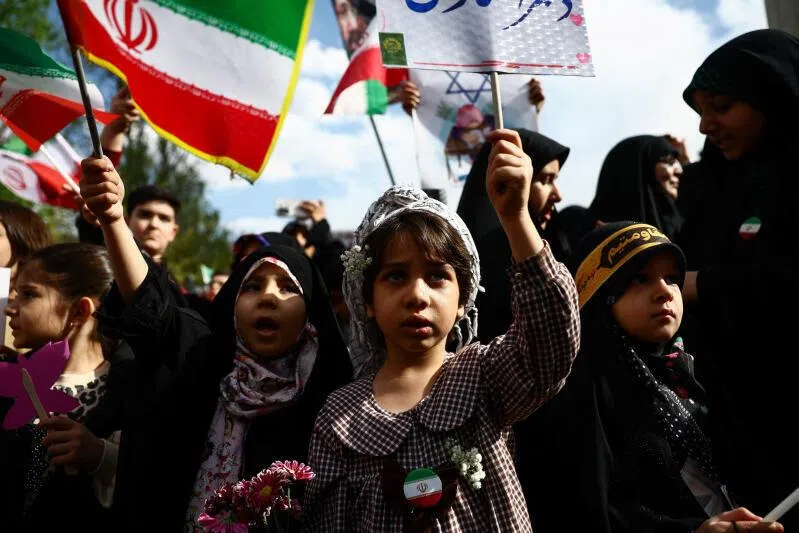 Iranian children attending a ceremony marking 40 days since schoolchildren were killed in a strike on a girls' primary school in Minab, in Tehran, Iran, on April 7, 2026.