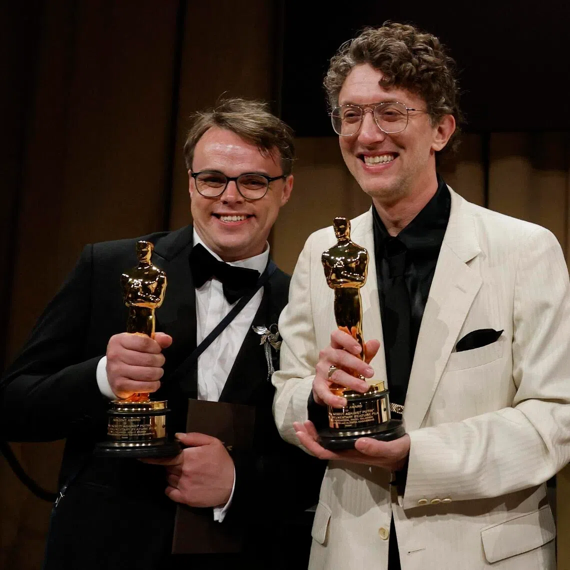 Russian director Pavel Talankin (left) and his co-director David Borenstein with their Oscar awards for Mr. Nobody Against Putin at the Governors Ball in Hollywood in March.
