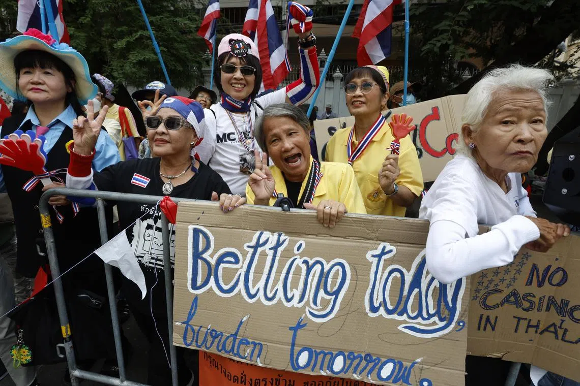 epa11902281 Thai protesters hold anti-casino placards as they attend a demonstration held to protest the government's draft of an entertainment complex act to legalize casino gambling, outside the the Council of State Office in Bangkok, Thailand, 17 February 2025. The protester group gathered to show opposition to casino gambling and showcase the downsides of gambling after the Thai cabinet on 13 January 2025 approved the draft Entertainment Complex Business Act in principle, paving the way to legalise casinos with entertainment complexes nationwide.  EPA-EFE/NARONG SANGNAK