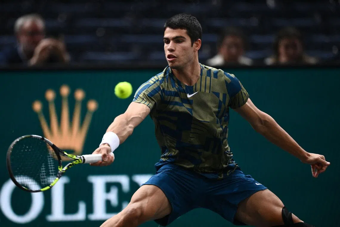 Spain's Carlos Alcaraz sailed into the Paris Masters third round with a 6-4 6-4 win over Yoshihito Nishioka.