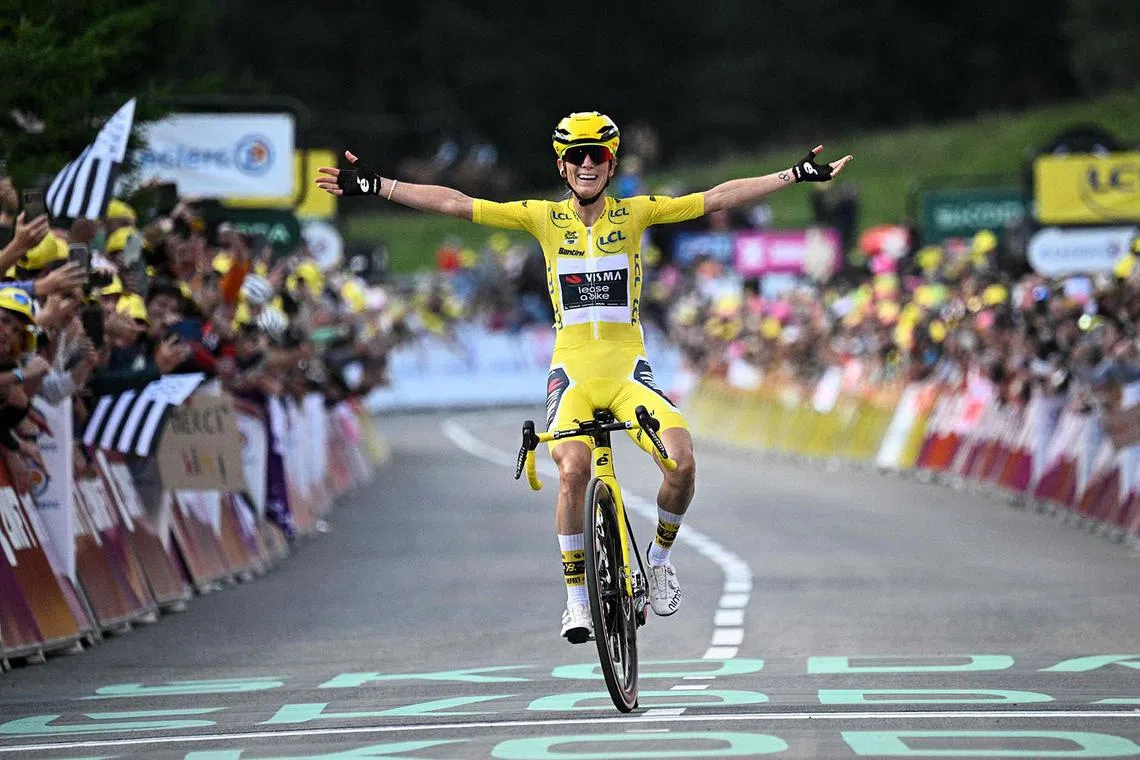 Visma-Lease a Bike's French rider Pauline Ferrand-Prevot celebrating as she crosses the finish line to win the 9th and final stage and the fourth edition of the Women's Tour de France cycling race, in Chatel eastern France, on Aug 3, 2025. 