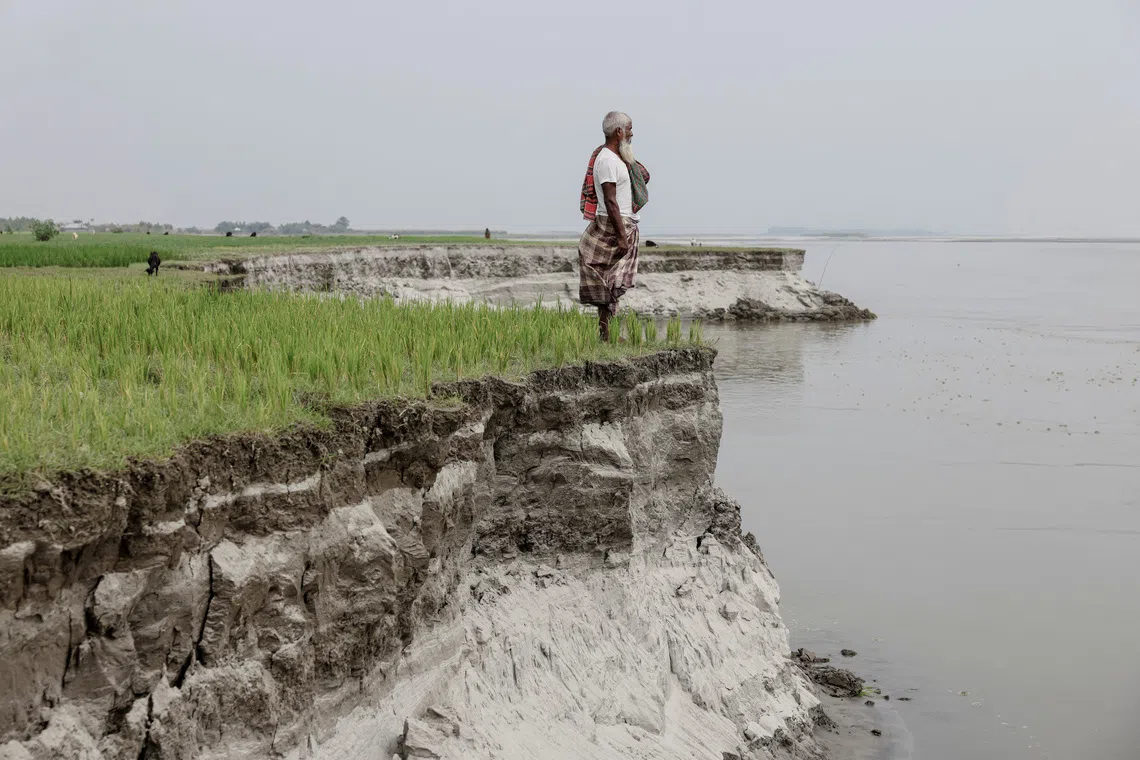 Every year, hundreds of families in Kurigram, Bangladesh, are faced with collapsed riverbanks and constant relocating.

Kosim Uddin, 50, looks toward the site of his vanished home as he poses for a picture on an island in the Brahmaputra River, where he recently relocated due to erosion, in Kurigram, Bangladesh, October 29, 2025. REUTERS/Mohammad Ponir Hossain