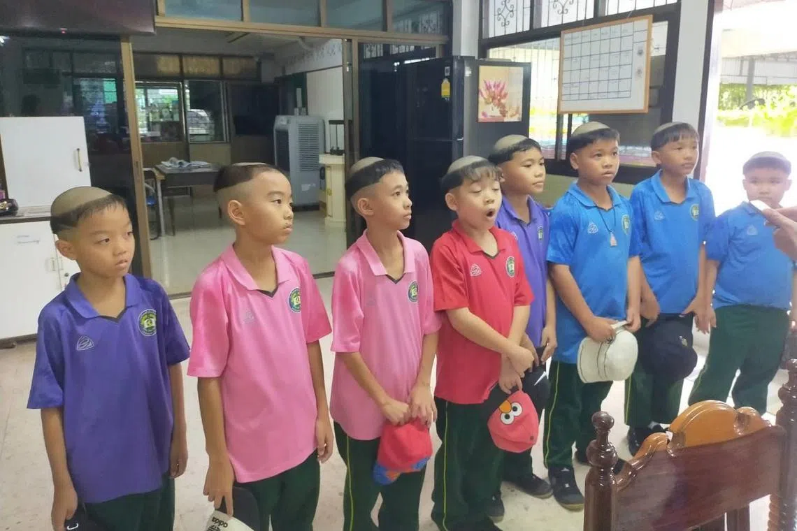 A group of boys could be seen sporting a coronal tonsure, a hairstyle common among Catholic monks until it was abolished in 1973.