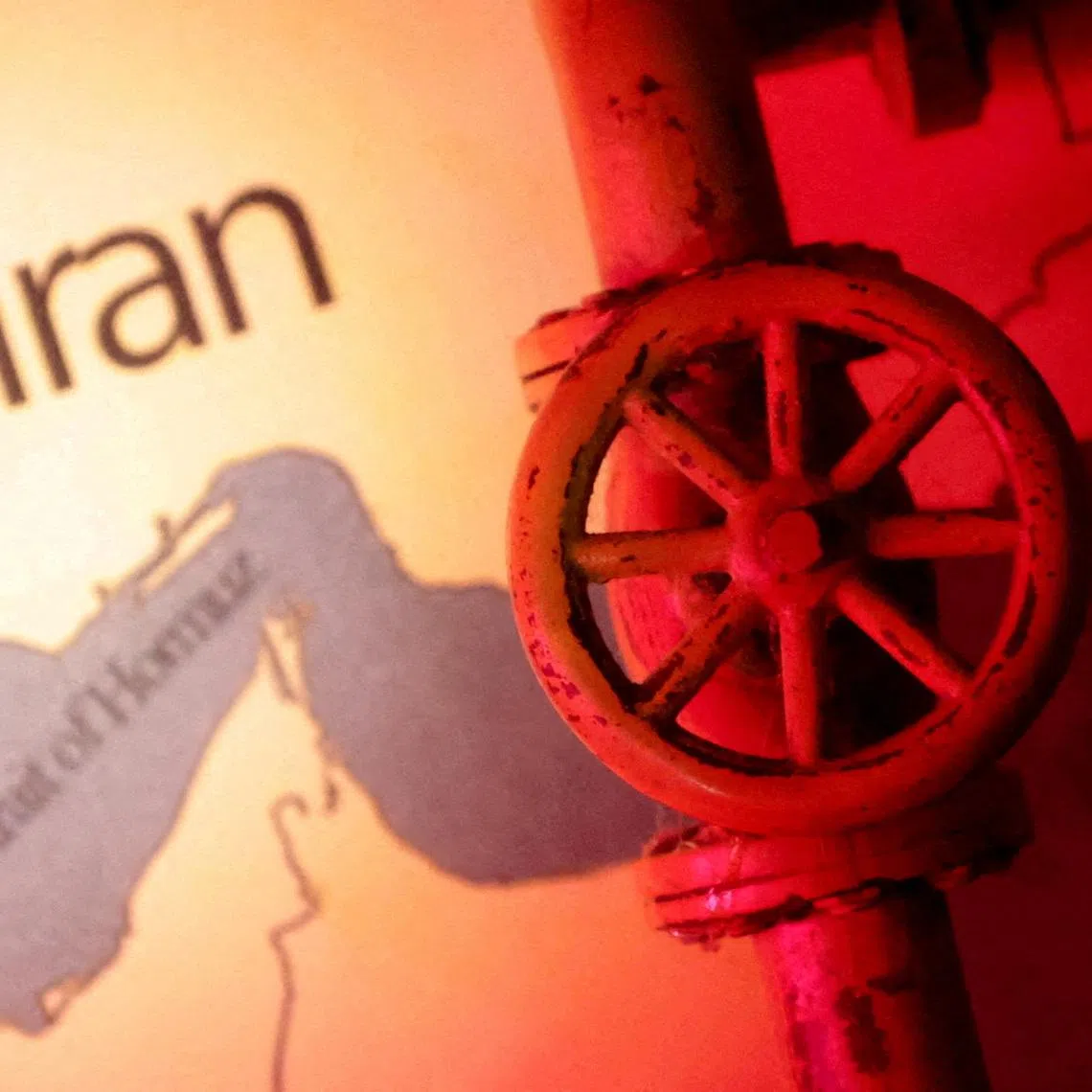 FILE PHOTO: A map showing the Strait of Hormuz and Iran is seen behind a 3D printed oil pipeline in this illustration taken June 22, 2025. REUTERS/Dado Ruvic/Illustration/File Photo