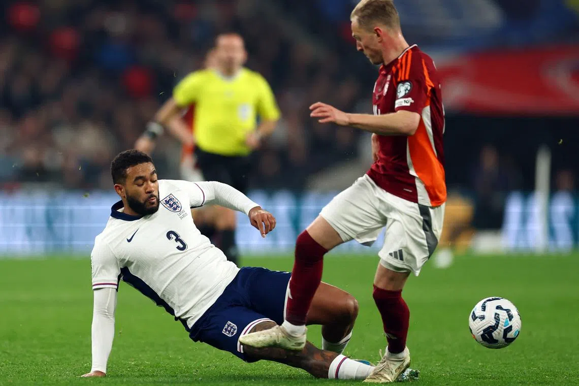 Soccer Football - World Cup - European Qualifiers - Group K - England v Latvia - Wembley Stadium, London, Britain - March 24, 2025 England's Reece James in action with Latvia's Andrej Ciganiks Action Images via Reuters/Matthew Childs