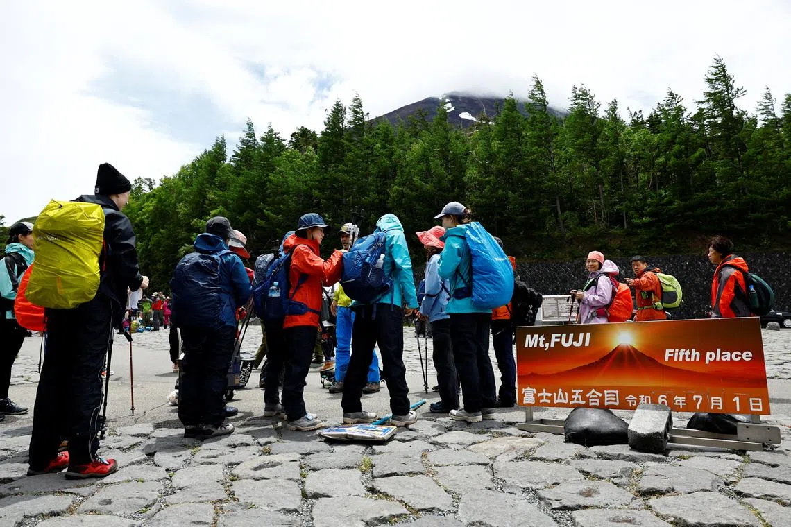 Climbers gather at the Fuji Yoshidaguchi Trail on the slopes of Mount Fuji on July 1.