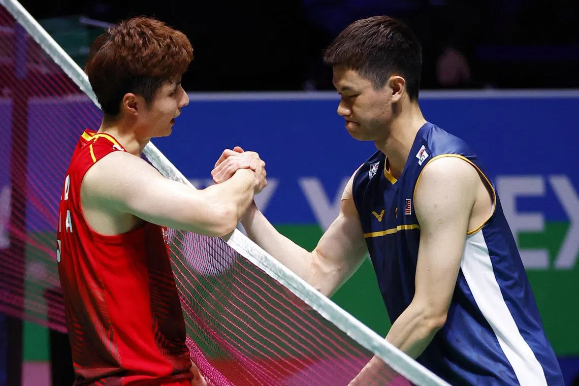 China's Shi Yuqi (left) consoles Malaysia's Lee Zii Jia after winning their All England Open semi-final on Saturday. 