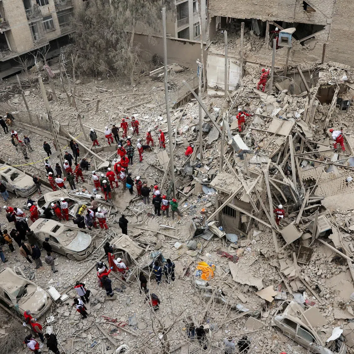 Emergency personnel work at the site of a strike on a residential building, amid the U.S.-Israeli conflict with Iran, in Tehran, Iran, March 16, 2026. Majid Asgaripour/WANA (West Asia News Agency) via REUTERS