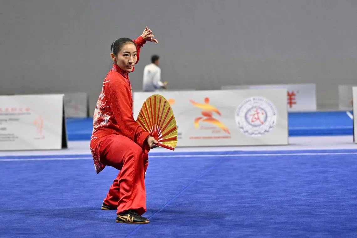 dltaiji26 - Singapore's Zeanne Law wins gold in the World Taijiquan Championships women's optional taijishan at the OCBC Arena.

credit: Cheah Cheng Poh
section: Sports
copyright: For SPH use only