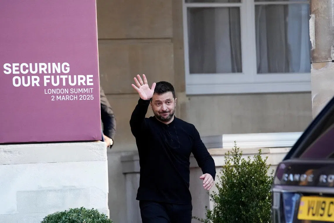 Ukraine’s President Volodymyr Zelenskiy waves on the day of a summit on Ukraine at Lancaster House in London, Britain, March 2, 2025. Christophe Ena/Pool via REUTERS