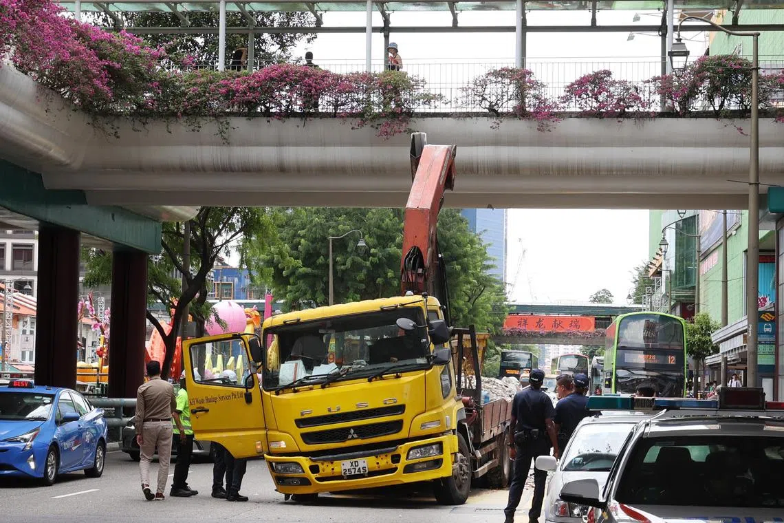 The lorry was tilted to one side after the incident and had cracks on its windshield.
