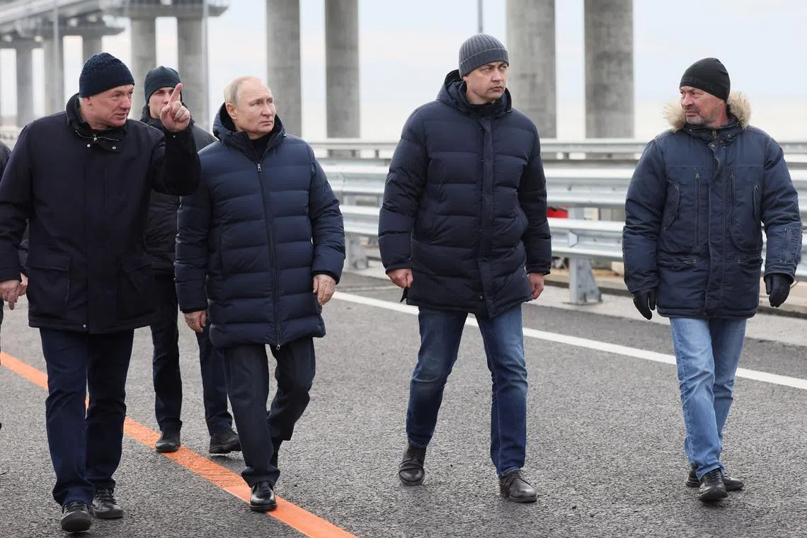 Russian President Vladimir Putin visits a bridge connecting the Russian mainland with the Crimean Peninsula.
