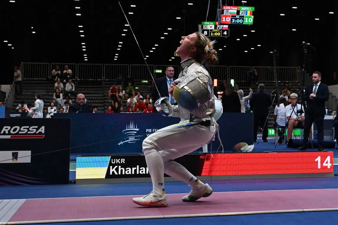 Ukraine's Olga Kharlan celebrates defeating Russia's Anna Smirnova (not pictured) at the World Championships in Milan.