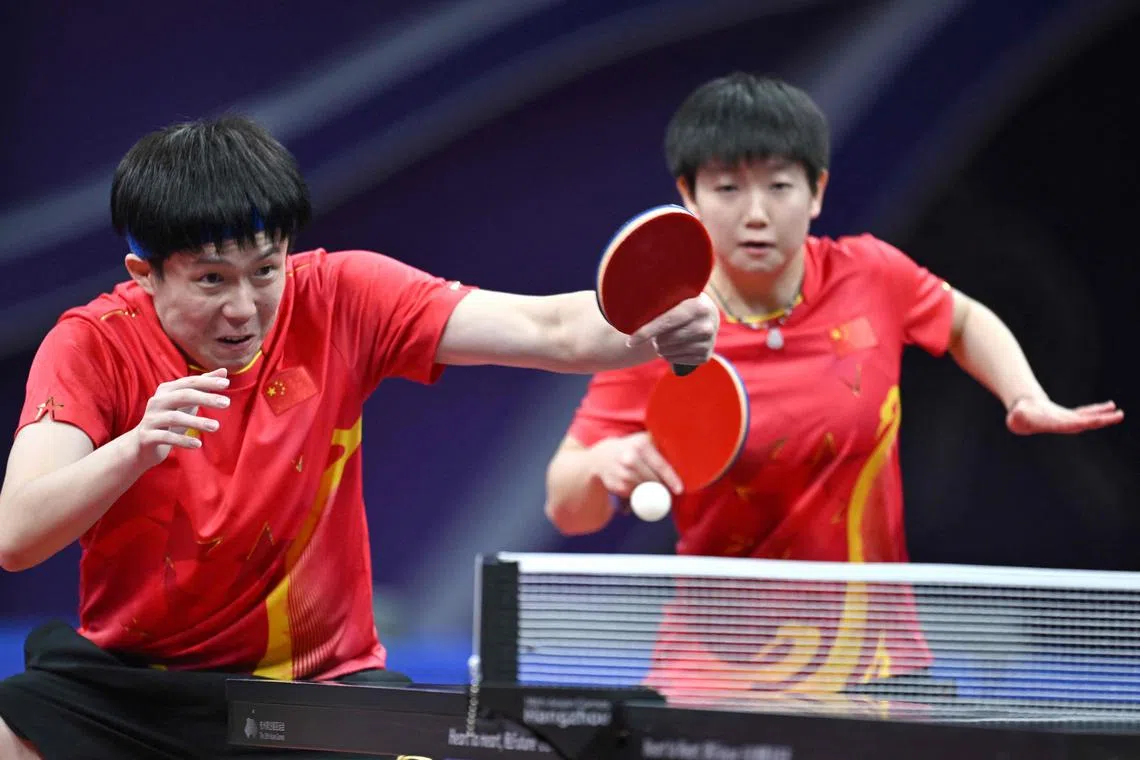 China's Wang Chuqin (left) and Sun Yingsha, the reigning world and Asian Games champions, won their mixed doubles match against the Germans at the ITTF Mixed Team World Cup in Chengdu on Dec 8.