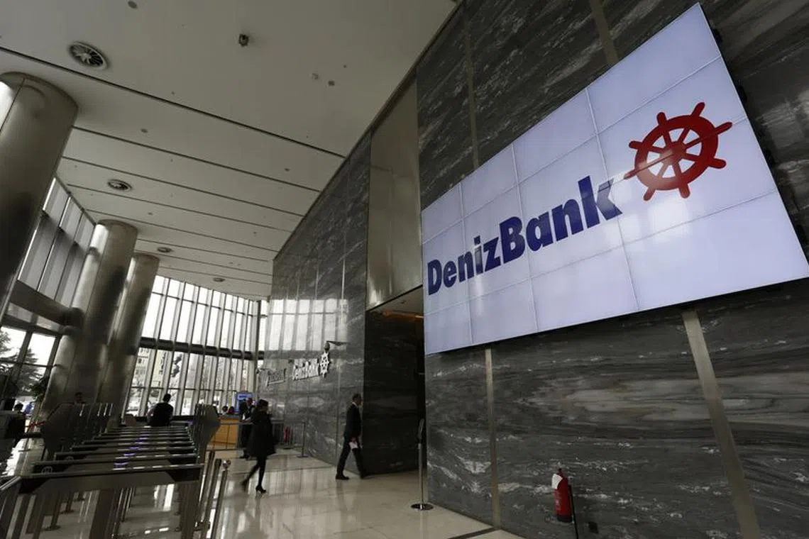 The logo of Denizbank is displayed on a screen at the bank's headquarters in Istanbul, Turkey March 2, 2016. REUTERS/Murad Sezer/ File photo