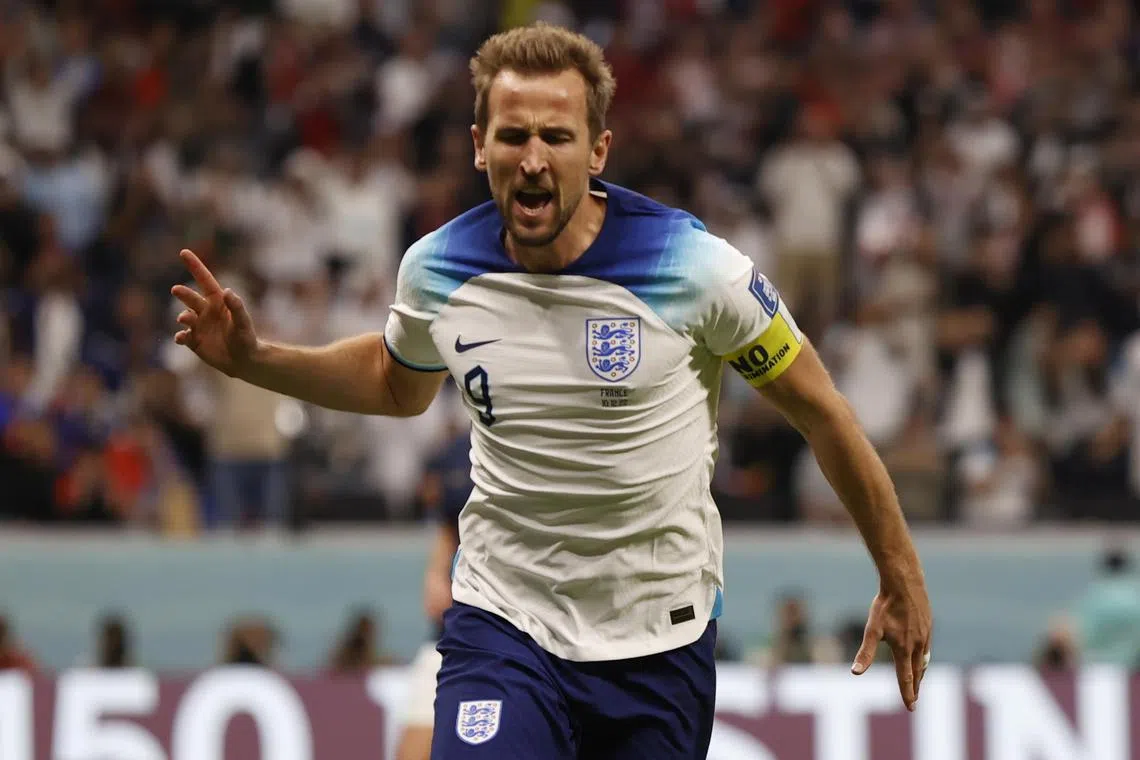 Harry Kane celebrates scoring for England to draw level with France in their World Cup 2022 quarter-final against France.