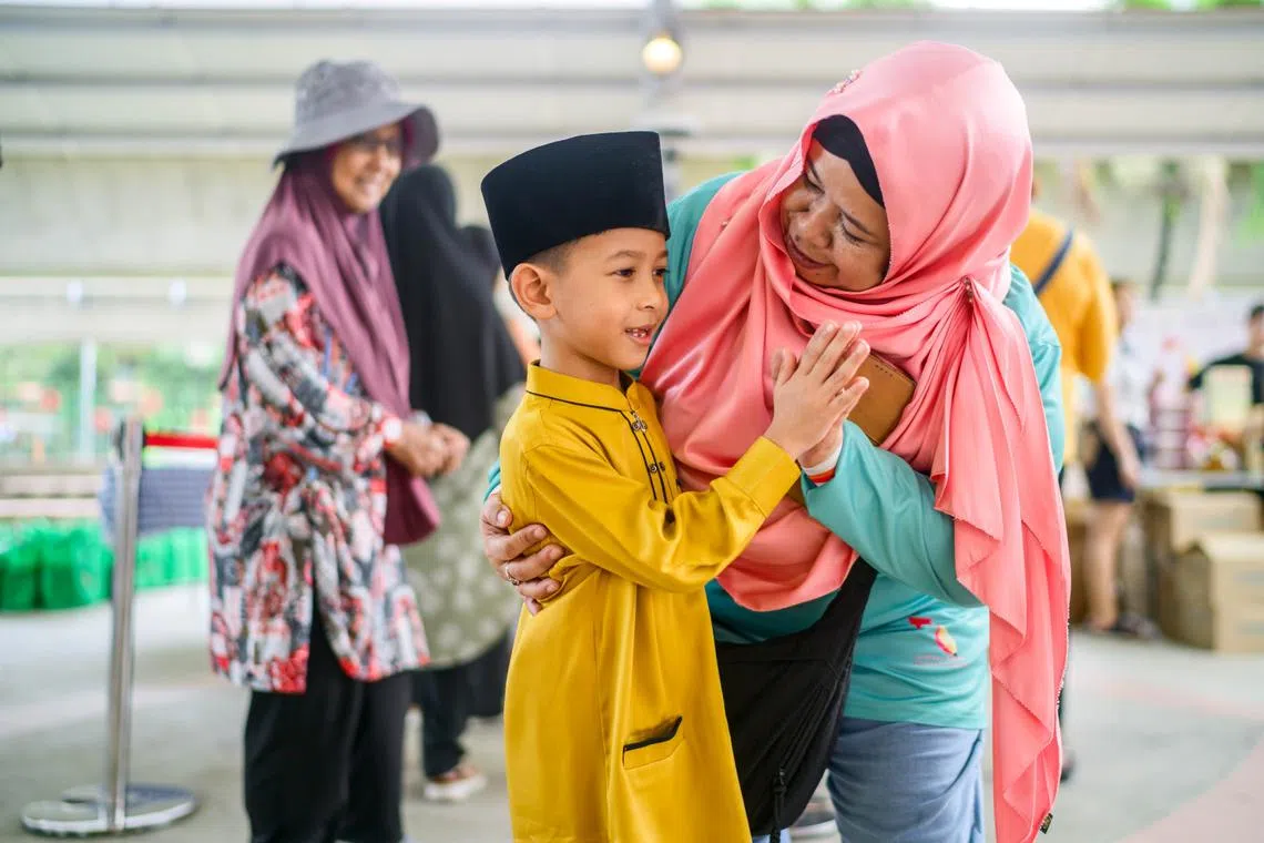 project pencil singapore founder sarimah amat with seven year old child from champs programme run by the ground up initiative