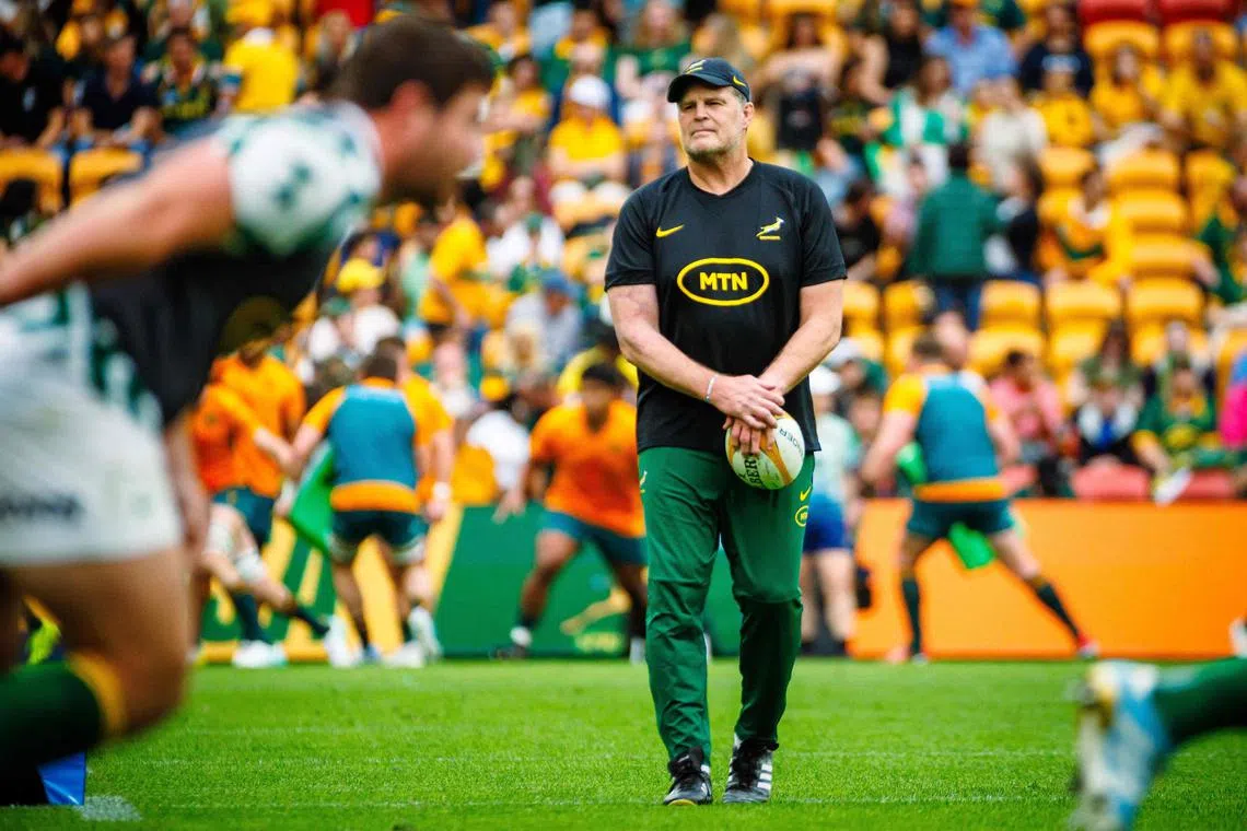 South Africa coach Rassie Erasmus watches his players warm up before the Rugby Championship match against Australia.