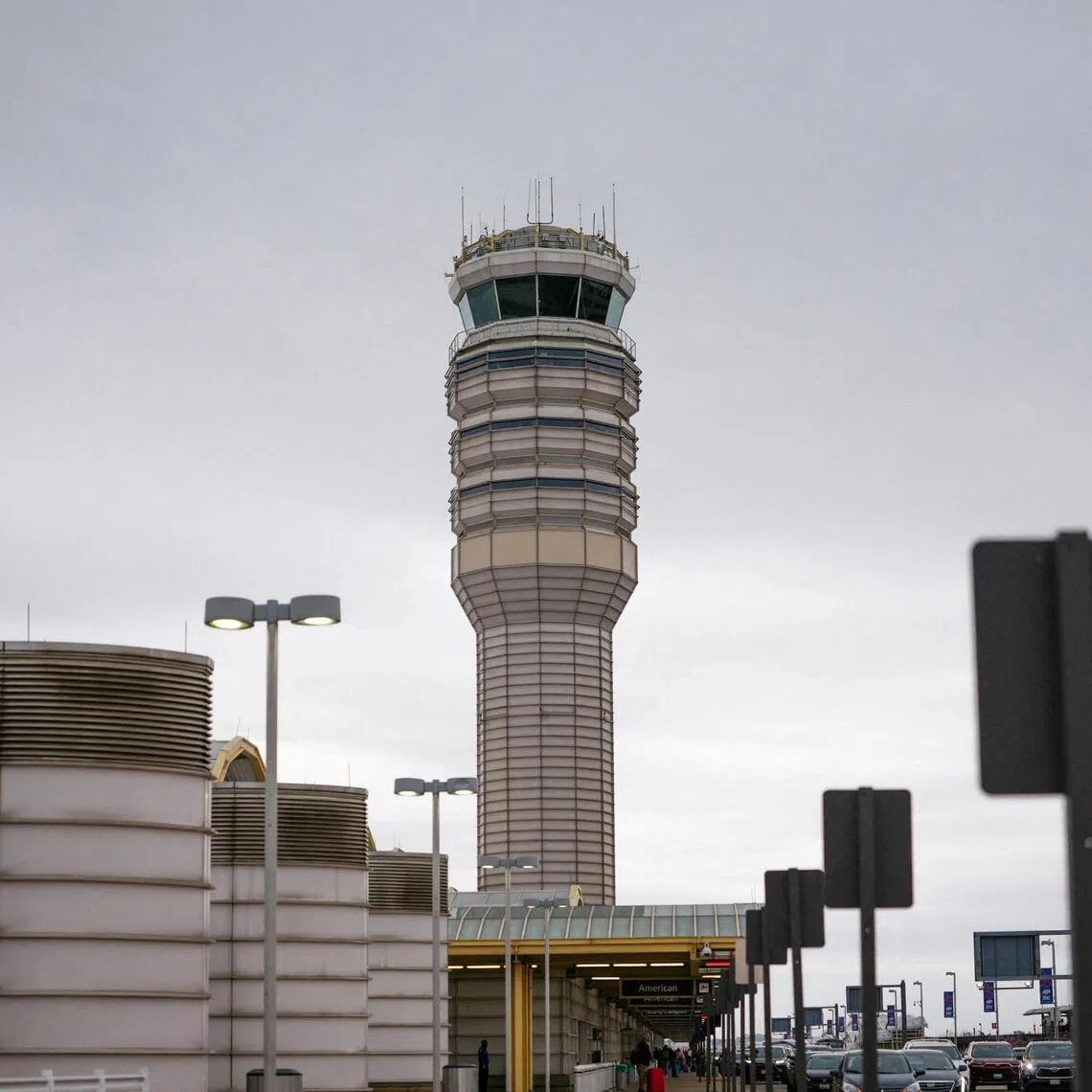FILE PHOTO: The Air Traffic Control tower at Ronald Reagan International Airport in Arlington, Virginia., U.S., March 15, 2026. REUTERS/Aaron Schwartz/File Photo