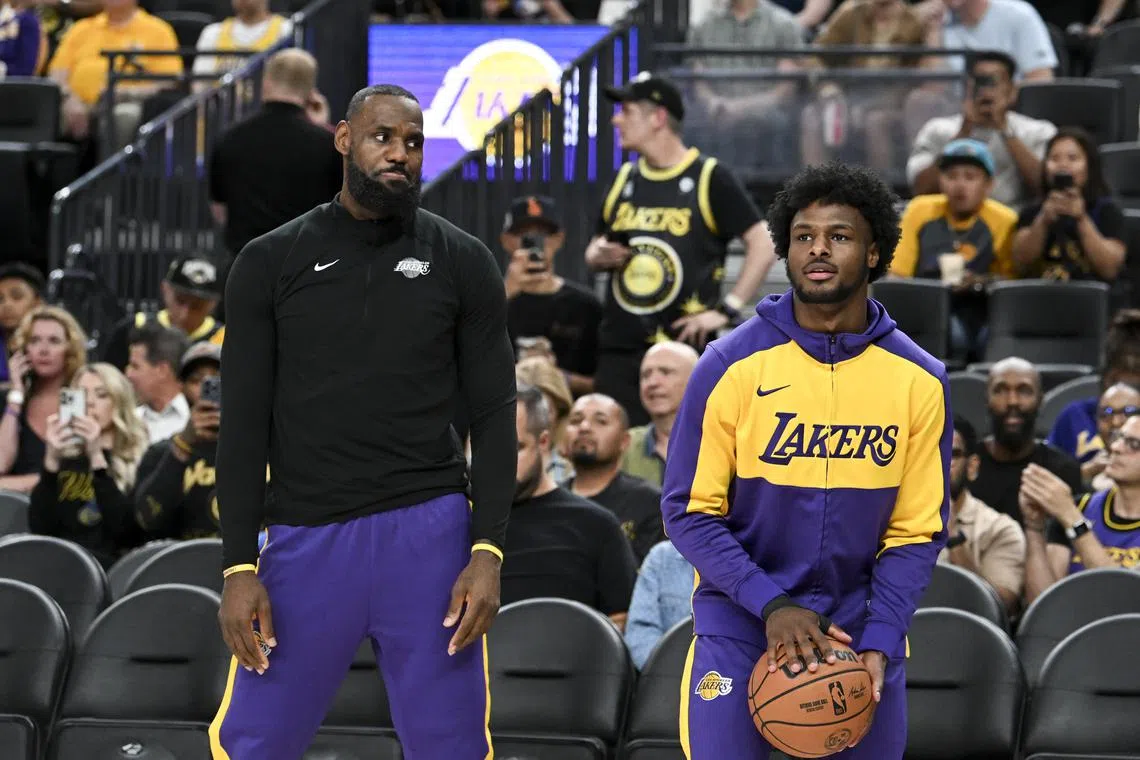 FILE PHOTO: Oct 15, 2024; Las Vegas, Nevada, USA; Los Angeles Lakers forward LeBron James (23) warms up with guard Bronny James (9) before the preseason game against the Golden State Warriors at T-Mobile Arena. Mandatory Credit: Candice Ward-Imagn Images/File Photo