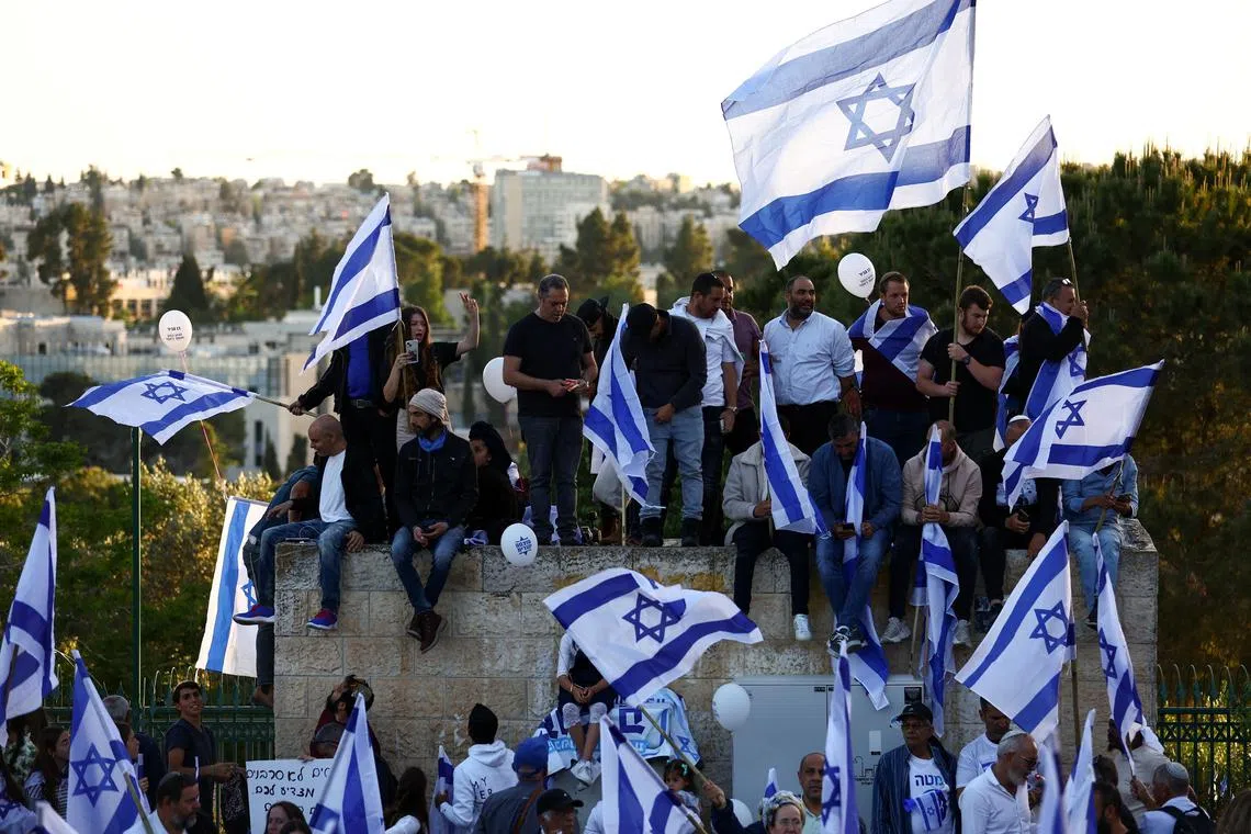 Right-wing demonstrators call on the Israeli government to complete its planned judicial overhaul, in Jerusalem.