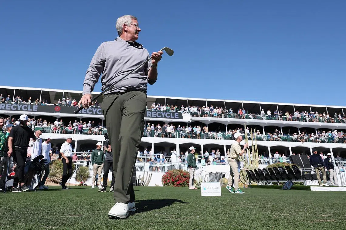 PGA Tour Commissioner Jay Monahan watches his tee shot on the 16th hole during the practice round prior to the Phoenix Open.