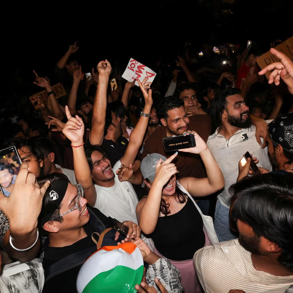 Cockroach Janta Party (CJP) supporters celebrate after the resignation of Education Minister Dharmendra Pradhan over National Eligibility cum Entrance Test (NEET) examination paper leaks, at Jantar Mantar in New Delhi, India, July 25, 2026. REUTERS/Priyanshu Singh