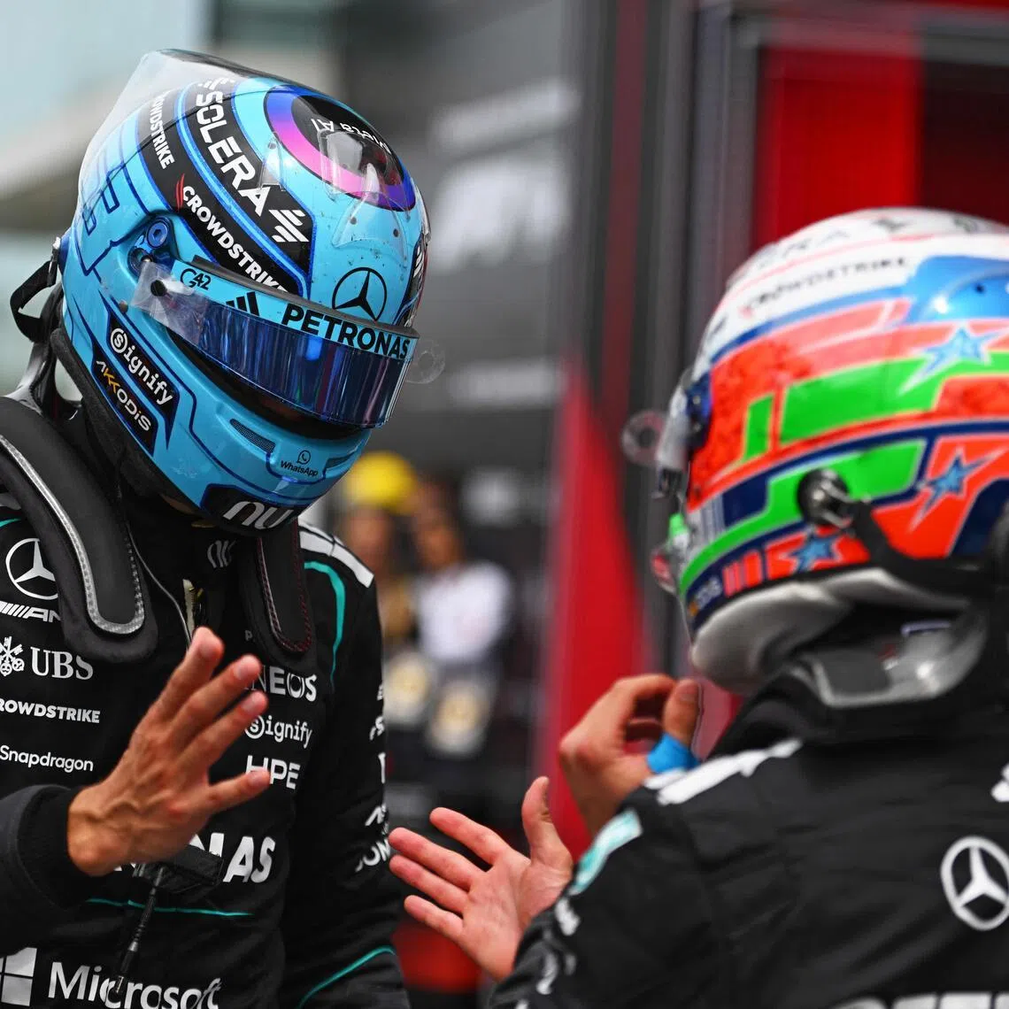 Sprint winner George Russell (left) and teammate Kimi Antonelli speaking in parc ferme after the May 23 race.