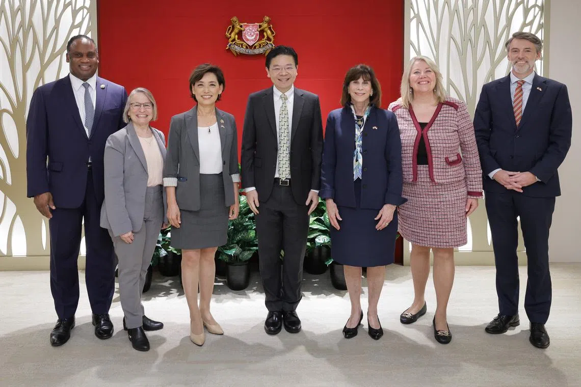(From left to right) US Representatives Jonathan Jackson, Mariannette Miller-Meeks and Young Kim, Deputy Prime Minister Lawrence Wong, Representatives Kathy Manning and Debbie Lesko, and US Embassy Deputy Chief of Mission and Charge d’Affaires Casey Mace