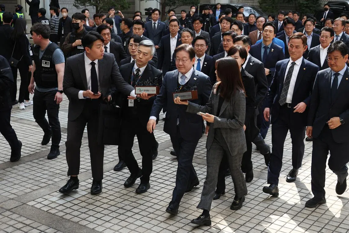 Lee Jae-myung, leader of South Korea's main opposition Democratic Party, arrives at a court in Seoul, South Korea, March 26, 2025.  REUTERS/Kim Hong-Ji/Pool/File Photo