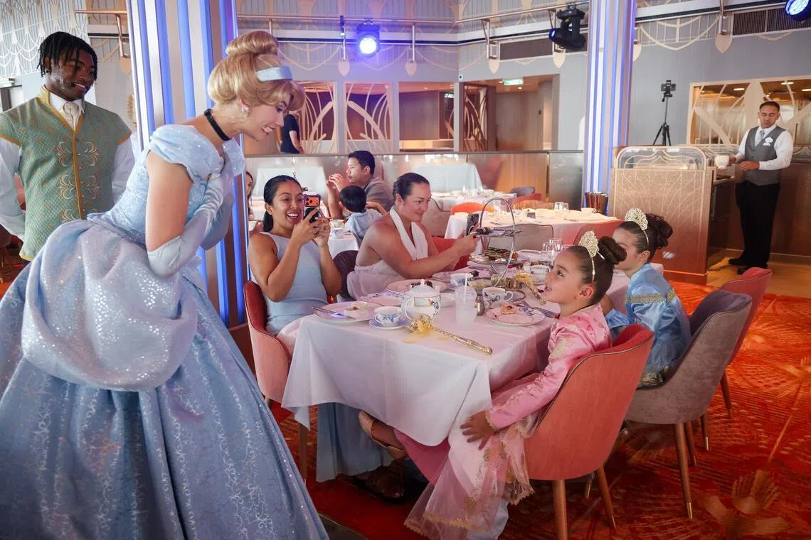 Cinderella greeting young guests at The Royal Society for Friendship and Tea.