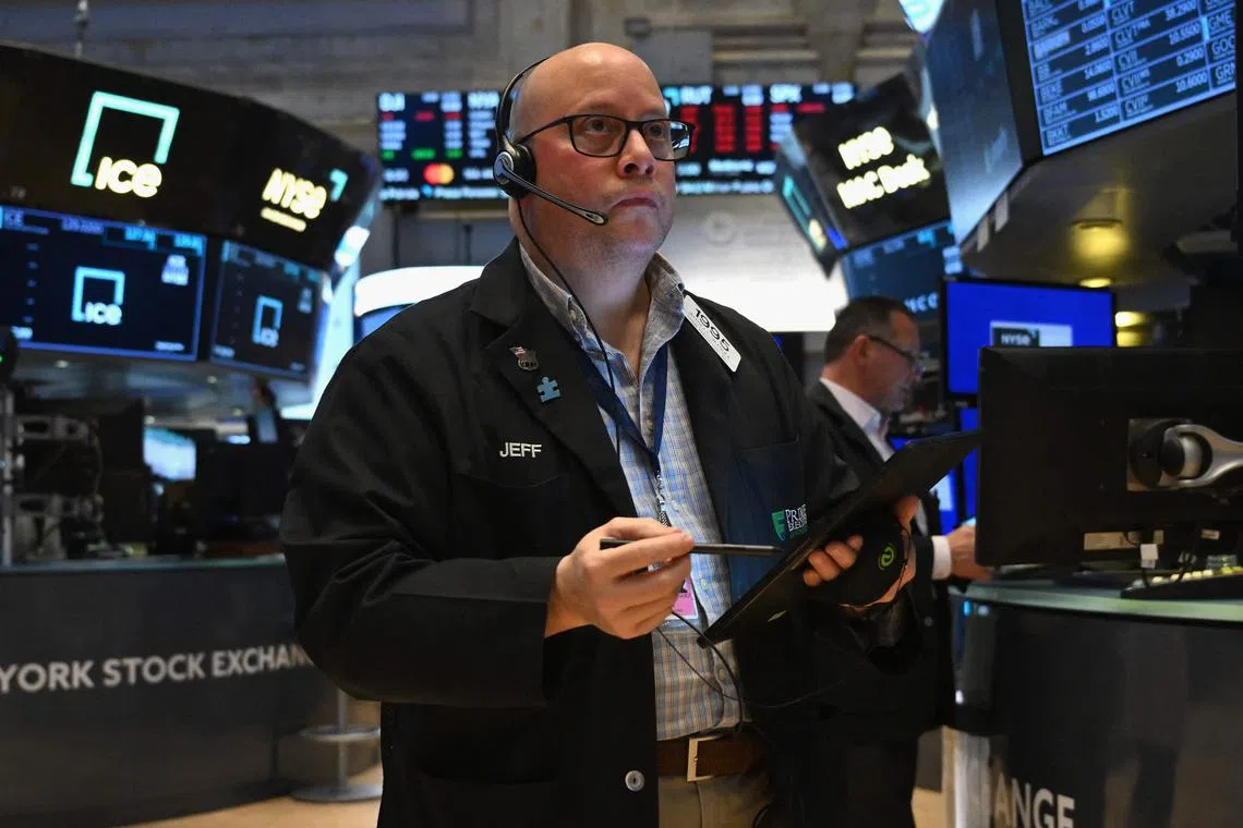 Traders work the floor of the New York Stock exchange, in New York City.
