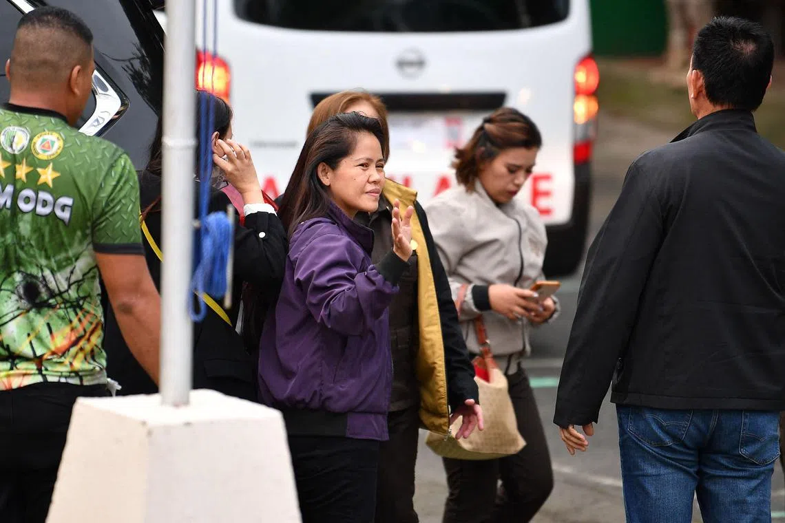 Mary Jane Veloso (centre) waves after arriving at the Correctional Institution for Women in Manila on Dec 18, 2024. 