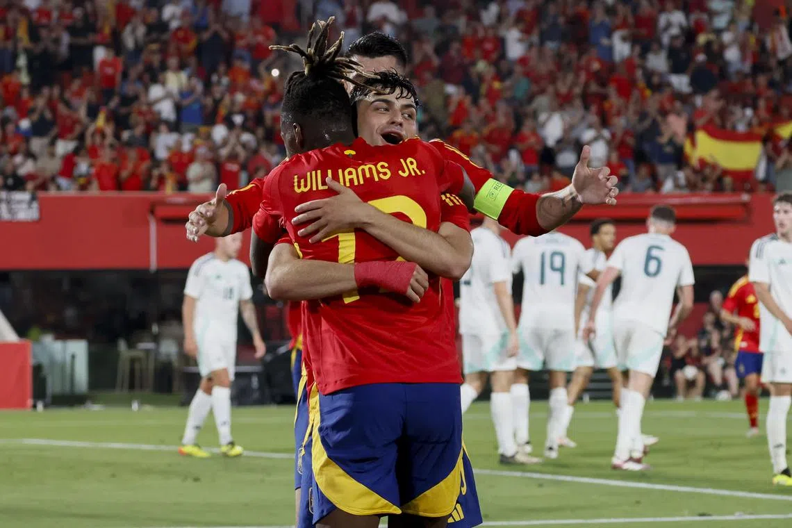Spain's Pedri Gonzalez celebrating with his teammates after scoring one of his two goals in the 5-1 friendly international win over Northern Ireland in Palma de Mallorca on June 8.