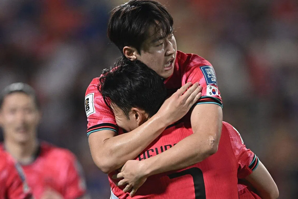 South Korea's Lee Kang-in celebrates with his captain Son Heung Min during the 3-0 World Cup qualifying win over Thailand.