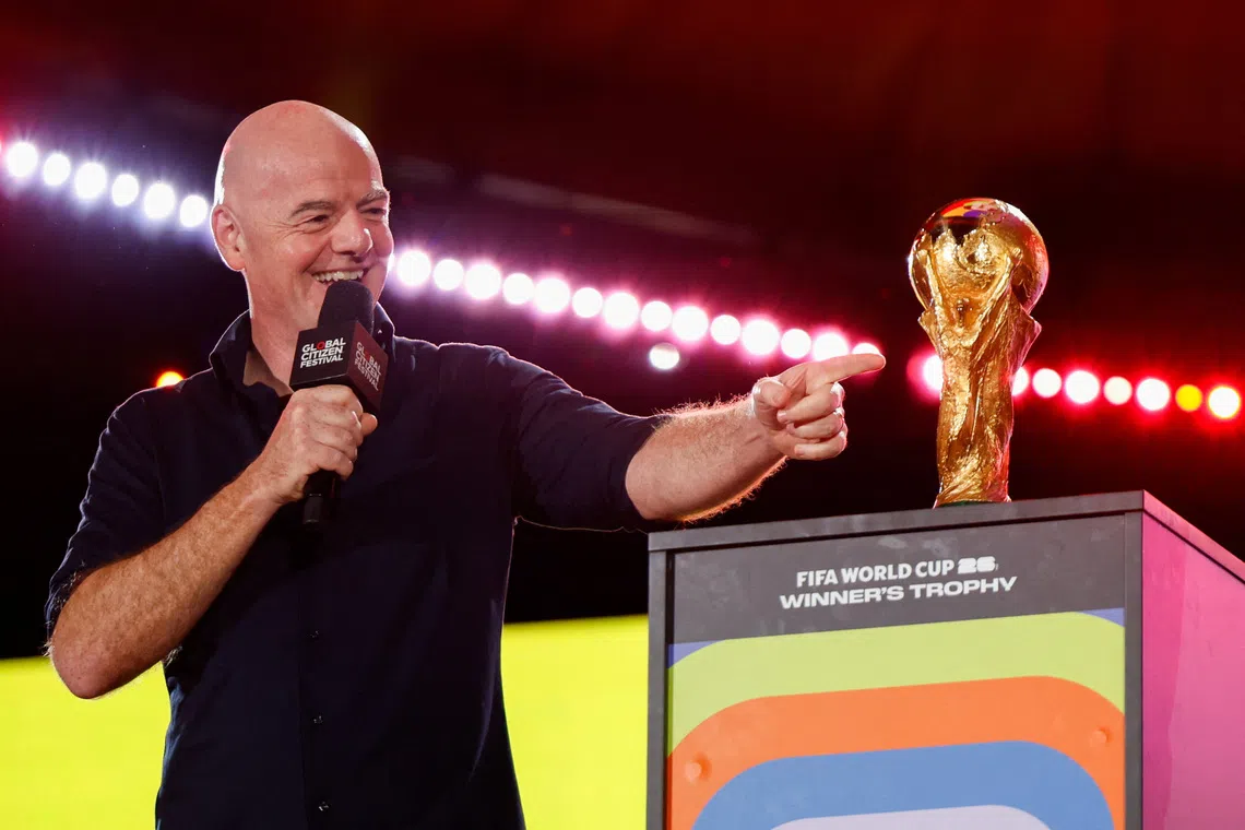 FIFA president Gianni Infantino gestures to the 2026 FIFA World Cup winner's trophy during the 2025 Global Citizen Festival in New York City, U.S., September 27, 2025. REUTERS/Kylie Cooper