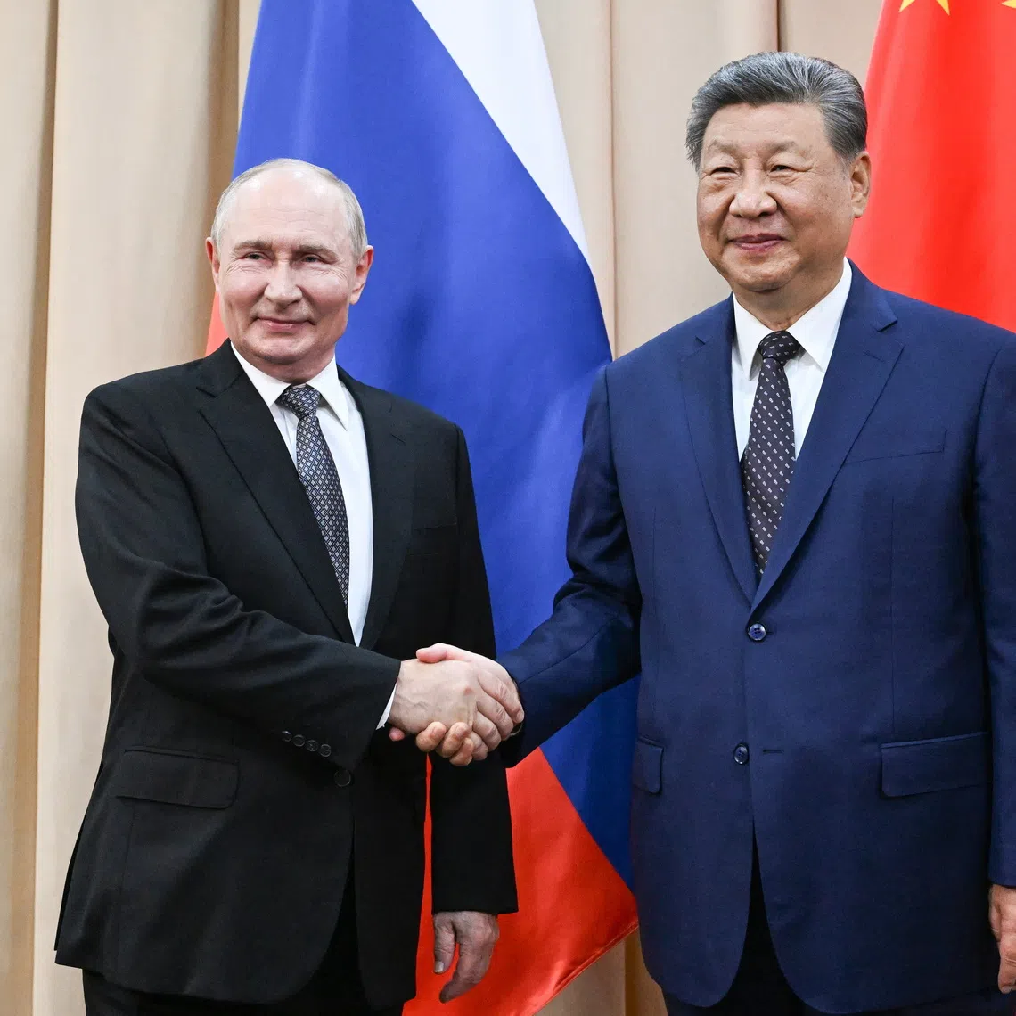 Russian President Vladimir Putin and Chinese President Xi Jinping meet before the Shanghai Cooperation Organization summit in Bishkek, Kyrgyzstan, on Aug 31.
