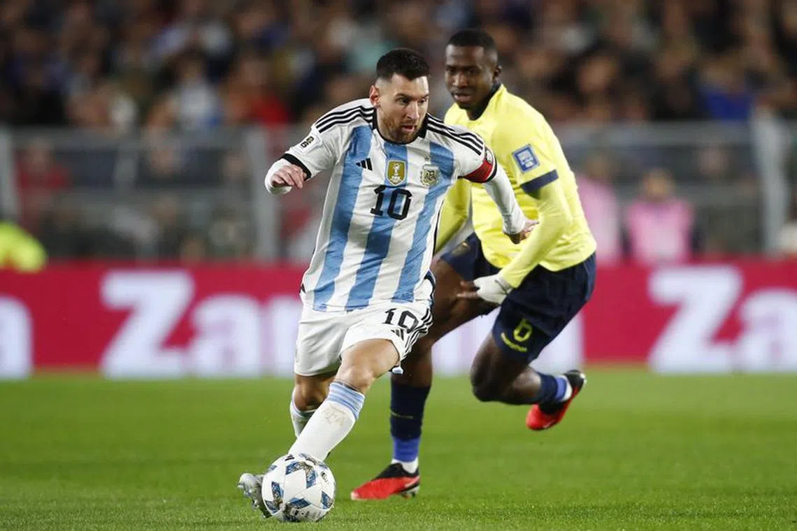 Soccer Football - World Cup - South American Qualifiers - Argentina v Ecuador - Estadio Mas Monumental, Buenos Aires, Argentina - September 7, 2023 Argentina's Lionel Messi in action with Ecuador's William Pacho REUTERS/Agustin Marcarian