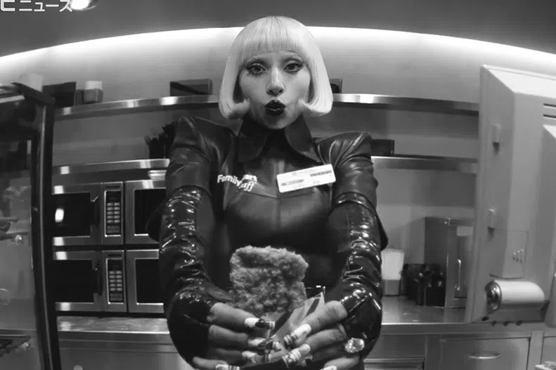 Lady Gaga can be seen shelving snacks, mopping floors and running the register in FamilyMart’s new recruitment ad.