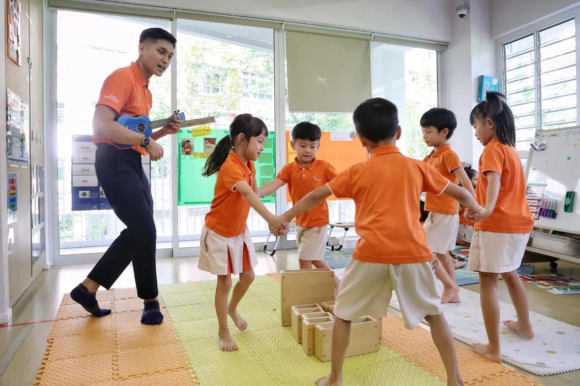 Muhammad Aliff Mohamed Murat, lead teacher at My First Skool in Rivervale Crescent, during a musical activity on Oct 27.