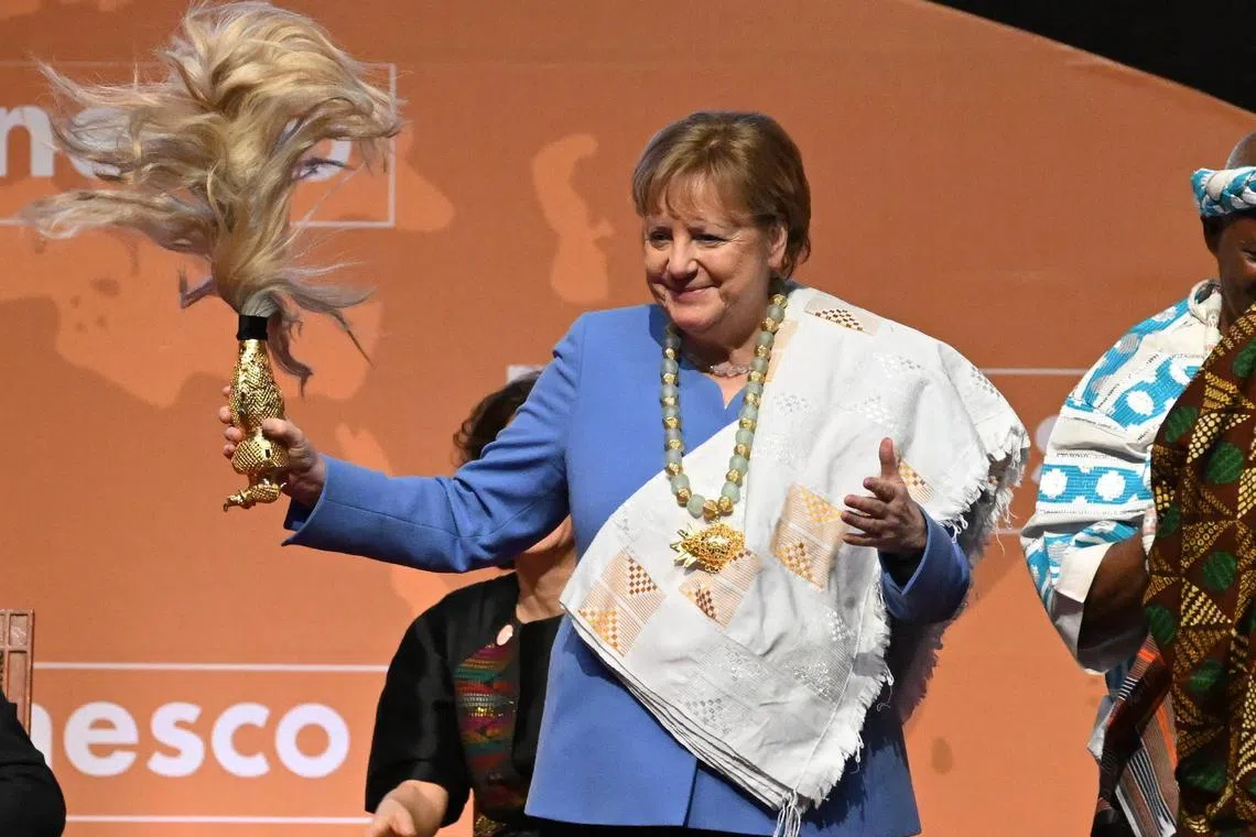 Former German Chancellor Angela Merkel gestures after receiving the Felix Houphouet-Boigny Peace Prize on Feb 8, 2023. 