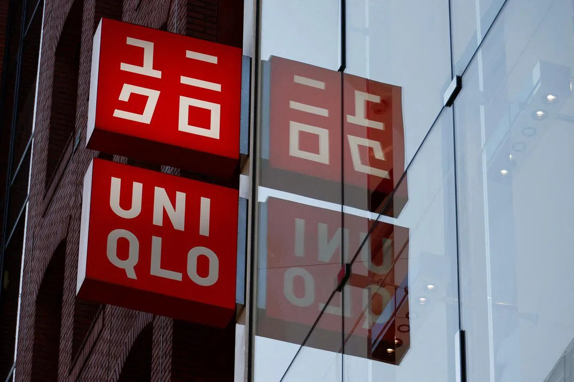 Fast Retailing's Uniqlo sign boards are displayed at a casual clothing store in Tokyo, Japan January 11, 2023.  The company said its operations in Russia remains suspended.