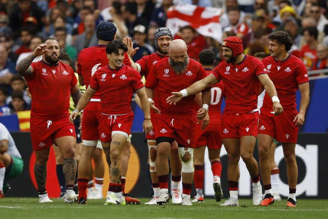 FILE PHOTO: Rugby Union - Rugby World Cup 2023 - Pool C - Georgia v Portugal - Stadium Municipal de Toulouse, Toulouse, France - September 23, 2023  Georgia's Gela Aprasidze celebrates scoring a try with teammates that was later disallowed REUTERS/Stephane Mahe/File Photo