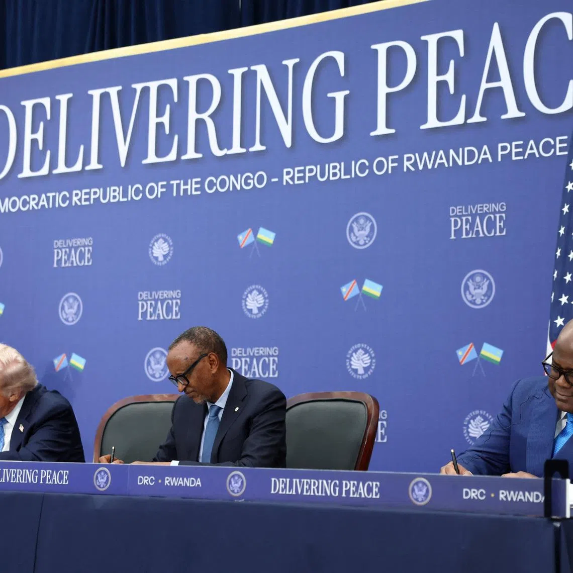 U.S. President Donald Trump, President of the Democratic Republic of the Congo Felix Tshisekedi and President of Rwanda Paul Kagame take part in a signing ceremony at the U.S. Institute of Peace in Washington, D.C., U.S., December 4, 2025. REUTERS/Kevin Lamarque/File Photo