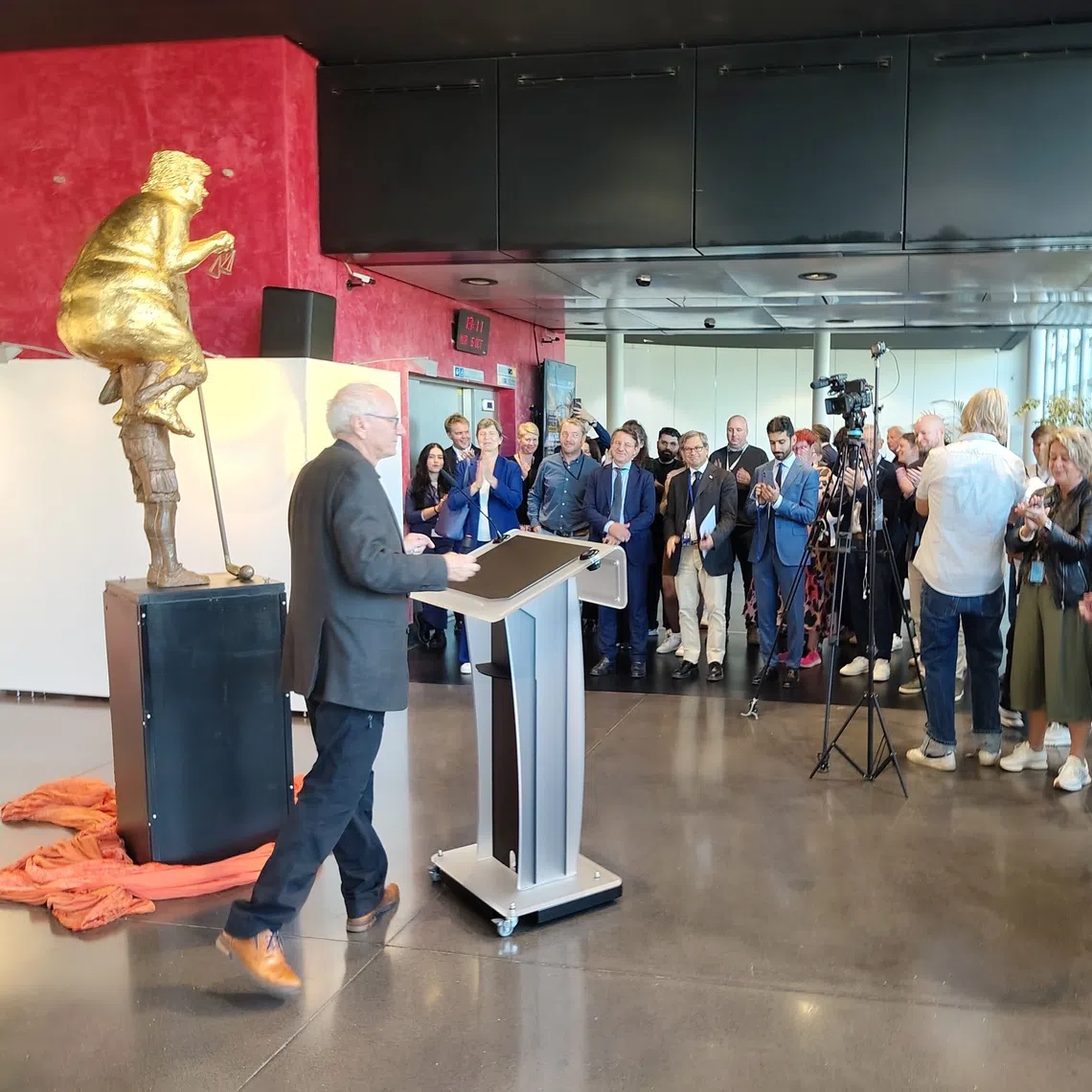 Danish artist Jens Galschiot unveils Orange Plague before reporters at the European Parliament building in Strasbourg, Germany.