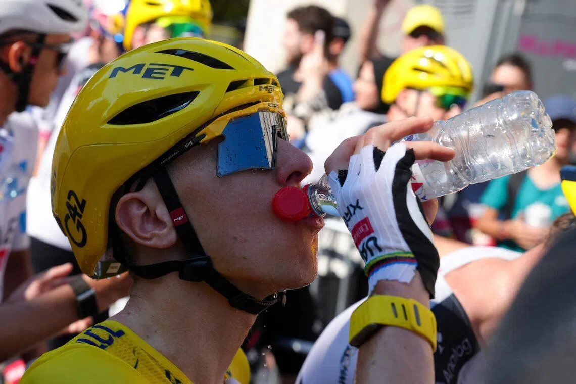 UAE Team Emirates - XRG's Slovenian rider Tadej Pogacar tries to cool off after the 4th stage of the 113th edition of the Tour de France cycling race, 182 km between Carcassonne and Foix in southwestern France, on July 7, 2026. (Photo by Thibault Camus / POOL / AFP)