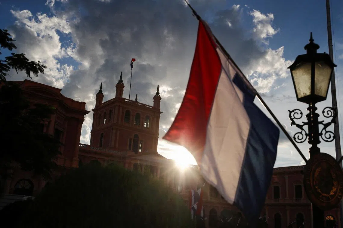 The Paraguayan flag waves outside the Presidential Palace in Asuncion, Paraguay May 1, 2023. REUTERS/Agustin Marcarian