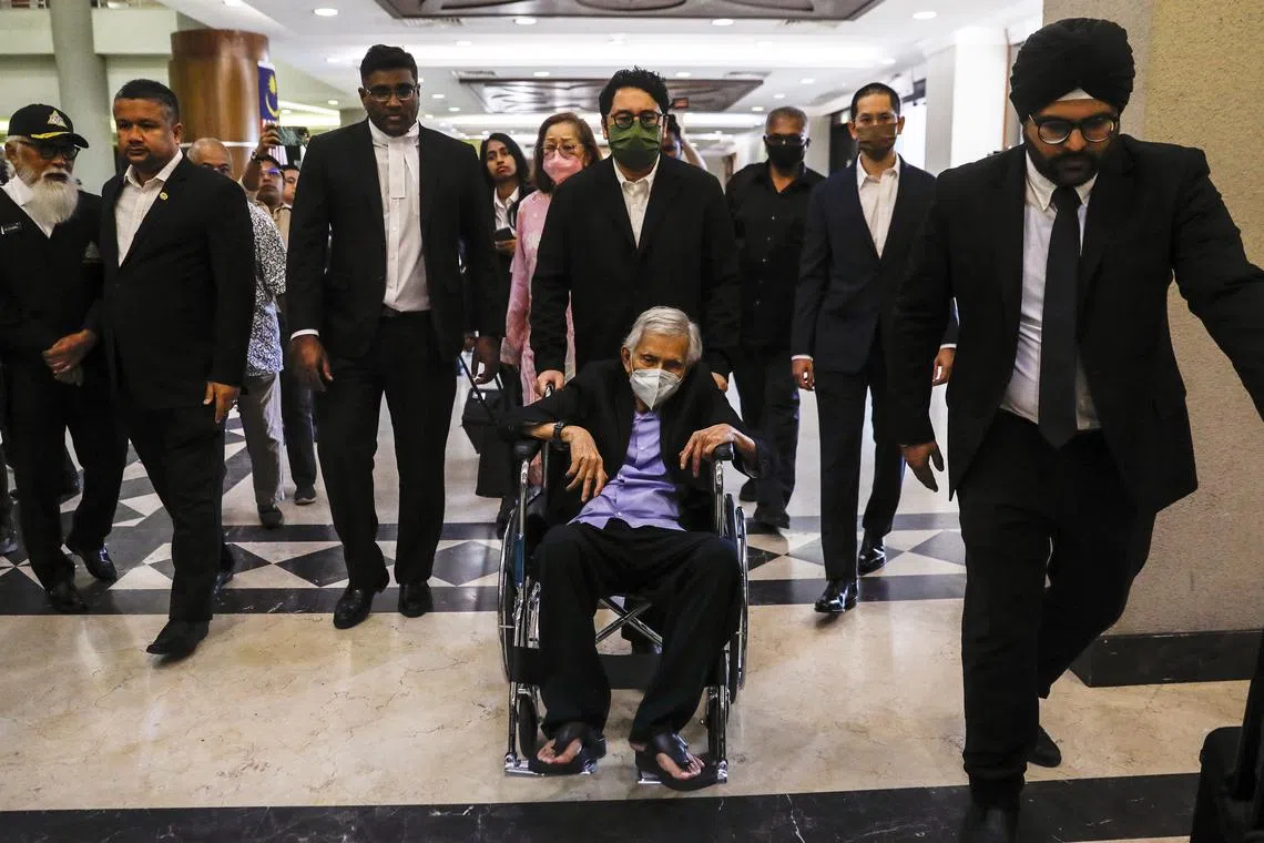 The wheelchair-bound former Malaysian  finance minister Daim Zainuddin was accompanied by his wife and other family members in court. 