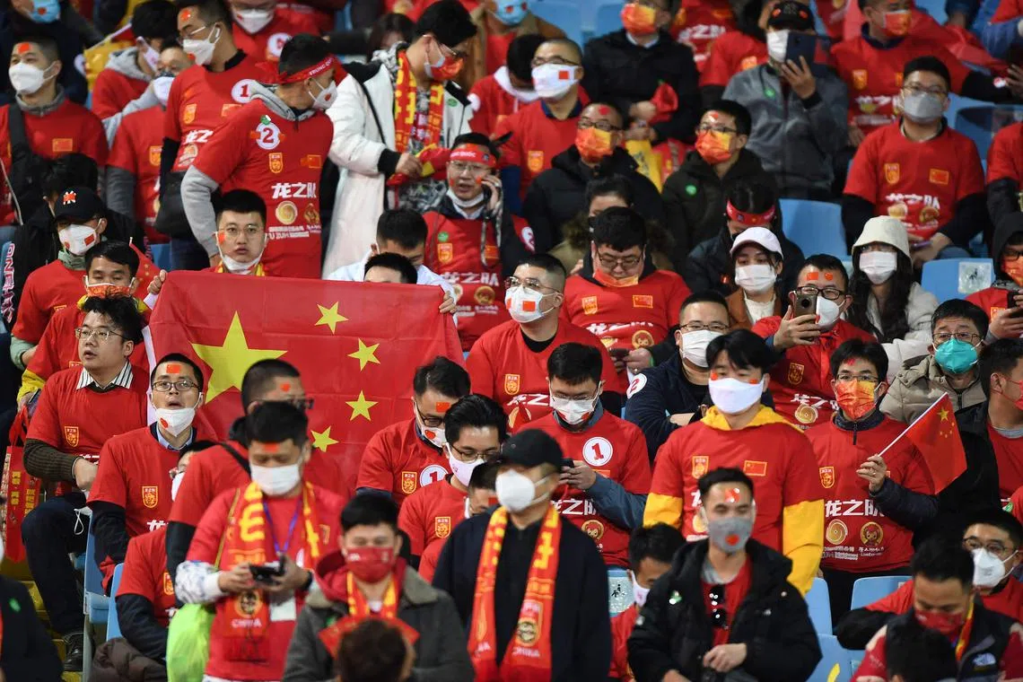 Chinese fans gather in the stands ahead of the Fifa World Cup Qatar 2022 qualifying round Group B football match on Feb 1, 2022. 